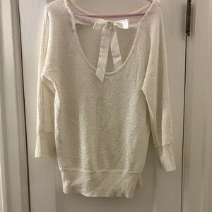 White House Black Market white sparkly sweater with bow in back